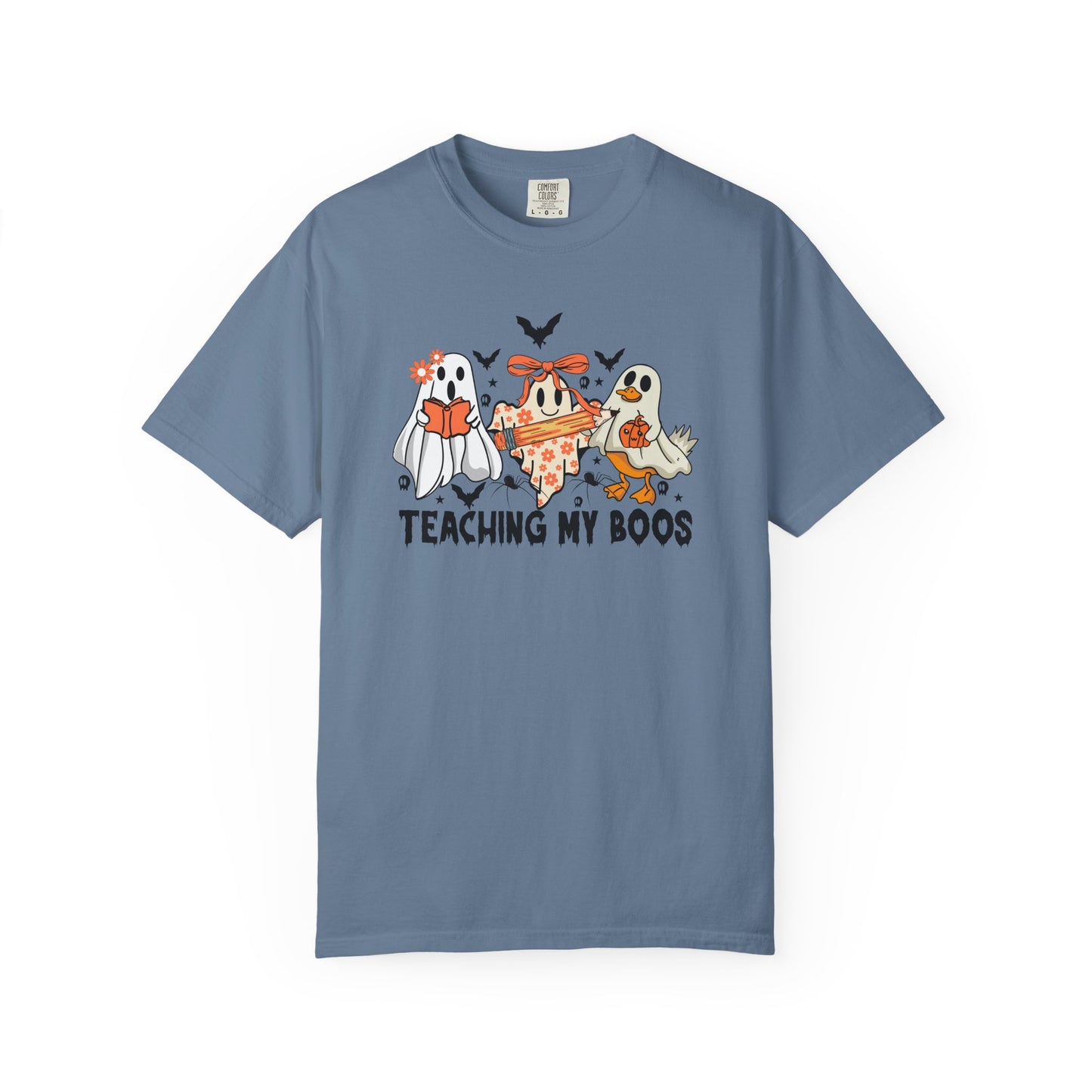 Blue t-shirt with Halloween-themed design of ghosts and text 'Teaching My Boos' on a white background