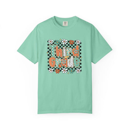 Mint green t-shirt with 'Third Grade' text and floral design on a white background