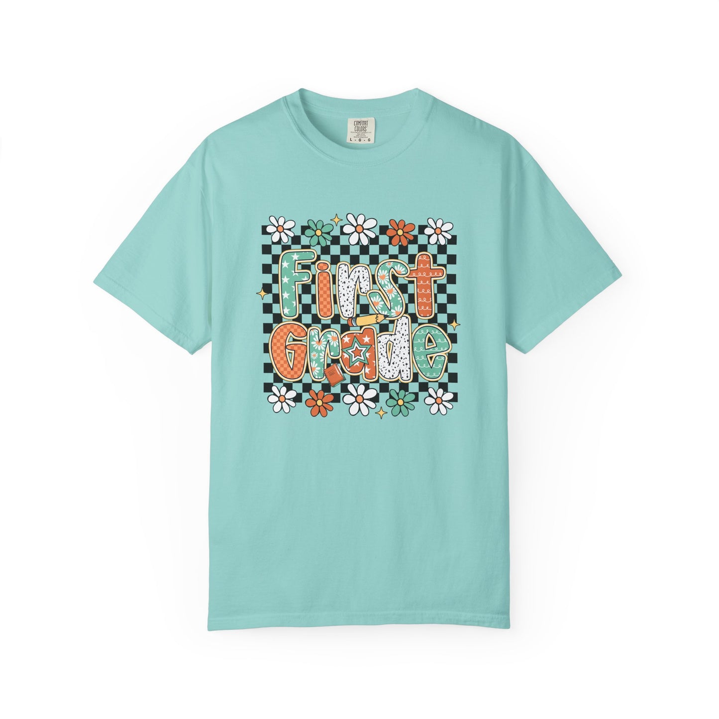 Light blue t-shirt with 'First Grade' text and floral design on a white background