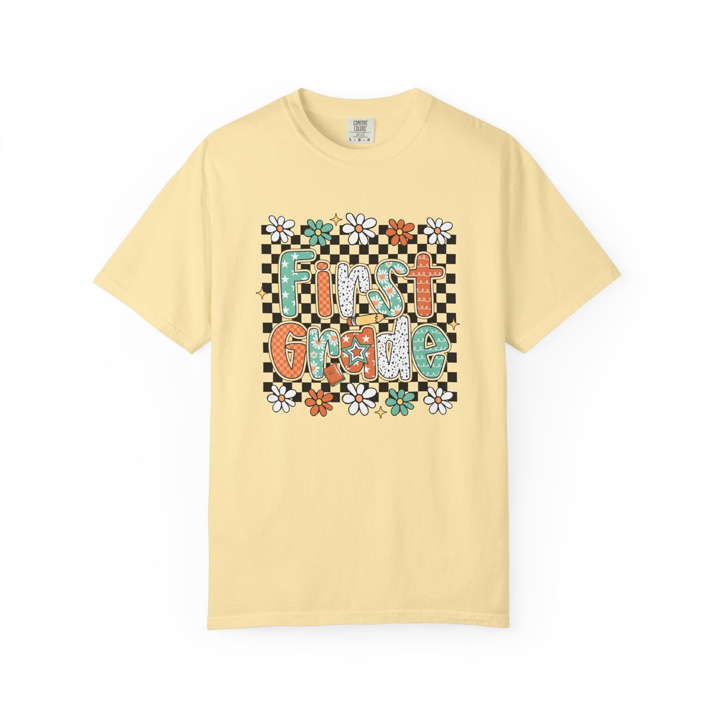 Yellow t-shirt with 'First Grade' text and floral design on a white background