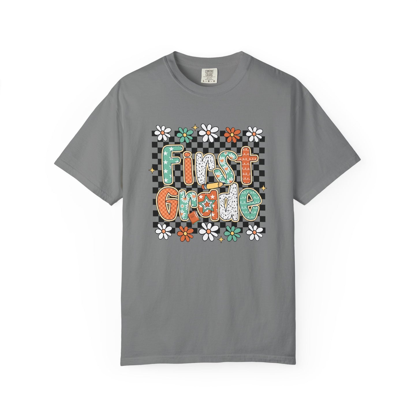 Gray t-shirt with 'First Grade' text and floral design on a white background