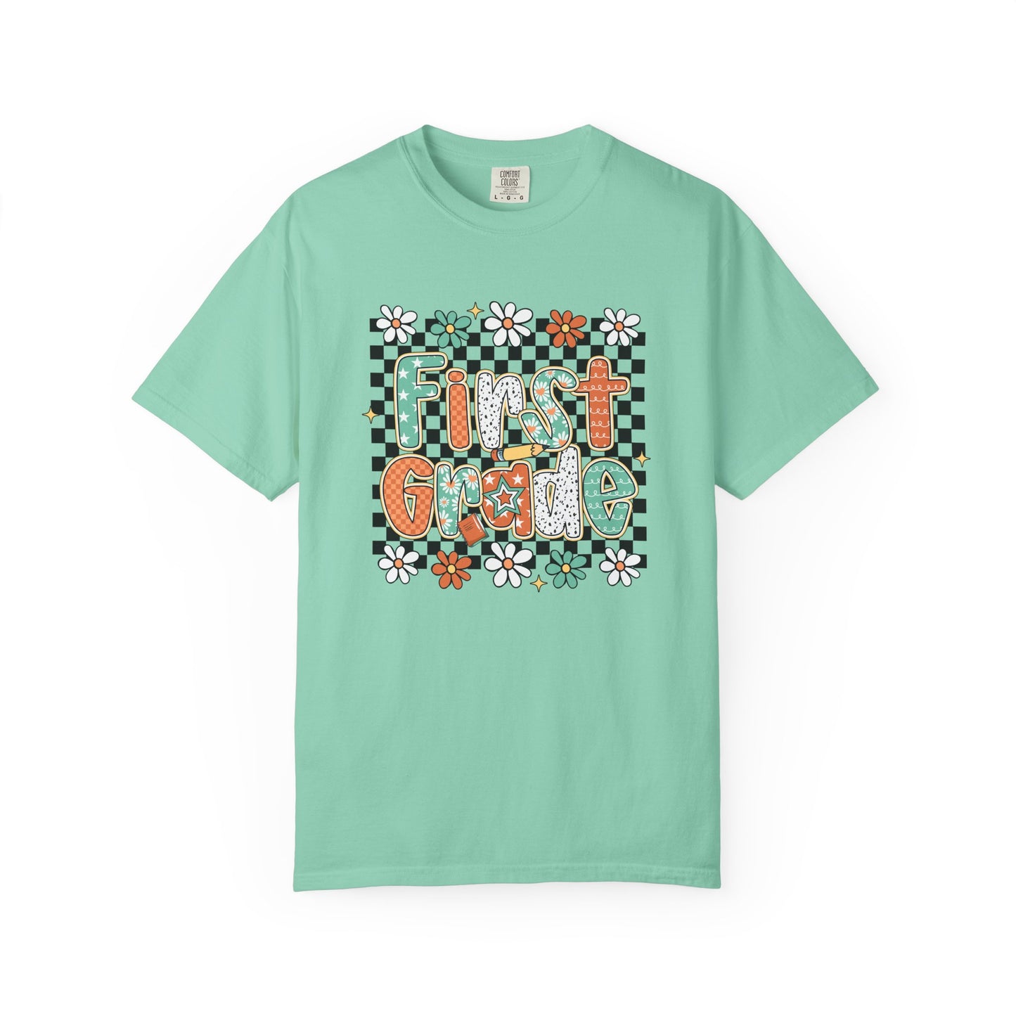 Mint green t-shirt with 'First Grade' text and floral design on a white background